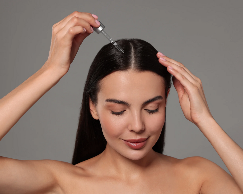 Daily scalp care serum being applied to the scalp with a dropper